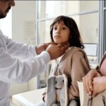 Doctor assessing Retropharyngeal Abscess on a child