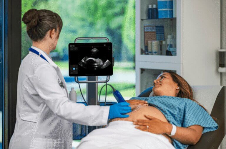 physician using Kosmos to ultrasound baby
